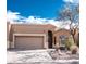 Charming single-story home featuring a two-car garage and low-maintenance desert landscaping at 5705 S Pinnacle Ln, Gold Canyon, AZ 85118