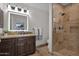 Bathroom featuring a glass-enclosed shower with tile surround and a vanity with granite countertop at 5914 E Dale Ln, Cave Creek, AZ 85331