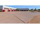 Expansive driveway with multiple garages and vibrant red bougainvillea bushes, plus fountain with desert landscaping at 5914 E Dale Ln, Cave Creek, AZ 85331