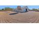 Wide exterior shot of a barn surrounded by rock and metal fence at 5914 E Dale Ln, Cave Creek, AZ 85331