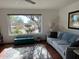 Inviting living room with a comfortable sofa and large windows offering picturesque views of the outdoors at 5914 E Dale Ln, Cave Creek, AZ 85331