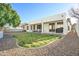 A backyard featuring a patio and synthetic grass at 6014 W Bent Tree Dr, Phoenix, AZ 85083