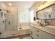 A modern bathroom featuring a soaking tub and glass shower at 6014 W Bent Tree Dr, Phoenix, AZ 85083