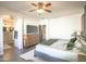 A primary bedroom featuring a gray upholstered bed and wood dresser at 6014 W Bent Tree Dr, Phoenix, AZ 85083