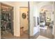 A bedroom viewed from the hallway featuring a gray upholstered bed at 6014 W Bent Tree Dr, Phoenix, AZ 85083