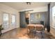 Cozy dining room with a barn door, unique chalkboard wall, and stylish decor at 6014 W Bent Tree Dr, Phoenix, AZ 85083