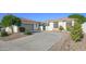 Home exterior featuring a well-manicured landscape with a variety of trees and shrubs at 6014 W Bent Tree Dr, Phoenix, AZ 85083