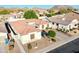 Charming single-story home with mature landscaping, neutral-tone stucco, red tile roof, and a paver driveway at 6014 W Bent Tree Dr, Phoenix, AZ 85083