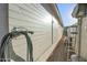 Exterior shot featuring well-maintained siding with a garden hose and metal ladder at 6014 W Bent Tree Dr, Phoenix, AZ 85083