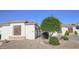 Home exterior featuring a well-manicured landscape with a variety of desert flora at 6014 W Bent Tree Dr, Phoenix, AZ 85083