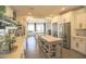 Beautiful kitchen featuring white cabinets, stainless steel appliances, and a large island at 6014 W Bent Tree Dr, Phoenix, AZ 85083