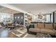 Open living area offers natural light, wood-look tile, and flows into the modern eat-in kitchen at 6014 W Bent Tree Dr, Phoenix, AZ 85083