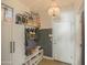 Organized mudroom with storage cabinets, shoe rack, and decorative chandelier at 6014 W Bent Tree Dr, Phoenix, AZ 85083