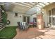 Outdoor living space on a brick patio with a pergola overhead and artificial turf at 6014 W Bent Tree Dr, Phoenix, AZ 85083