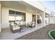 An outdoor patio featuring a seating area and ceiling fan at 6014 W Bent Tree Dr, Phoenix, AZ 85083