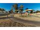 Curving community path leading through the neighborhood to playground, with open space and play structures at 635 W Douglas Ave, Gilbert, AZ 85233