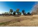 Expansive community open space and playground featuring covered play structures, with mature landscaping at 635 W Douglas Ave, Gilbert, AZ 85233