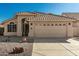 Charming single-story home featuring a well-manicured desert landscape, neutral stucco exterior, and a tile roof at 635 W Douglas Ave, Gilbert, AZ 85233