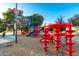 Bright and colorful community playground with climbing structure, slides, and play equipment on playground at 635 W Douglas Ave, Gilbert, AZ 85233