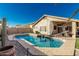 Backyard pool with desert landscaping offers a refreshing retreat in a private setting at 635 W Douglas Ave, Gilbert, AZ 85233