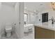 Modern bathroom featuring a soaking tub, glass shower, and double sink vanity at 7607 E Charter Oak Rd, Scottsdale, AZ 85260