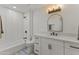 Well-lit bathroom showcasing a vanity with drawers and a shower and bathtub combo at 7607 E Charter Oak Rd, Scottsdale, AZ 85260