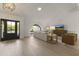 Light and bright living room featuring hardwood floors, modern furnishings, and arch window at 7607 E Charter Oak Rd, Scottsdale, AZ 85260