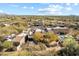 Aerial view of a desert home with a tile roof, a pool, and a private backyard at 9221 E Whitethorn Cir, Scottsdale, AZ 85266