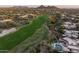 Beautifully landscaped golf course community with lush fairways, sand traps, homes, and swimming pools in Arizona at 9221 E Whitethorn Cir, Scottsdale, AZ 85266