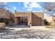 Front exterior showcasing attached garage, porte-cochere and neutral paint at 9221 E Whitethorn Cir, Scottsdale, AZ 85266