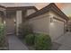 Front exterior view of a home featuring a two-car garage, tidy landscaping and covered entryway at 9513 E Hercules Dr, Sun Lakes, AZ 85248