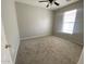 Bedroom with carpet flooring and a window with blinds at 10030 W Illini St, Tolleson, AZ 85353