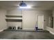 Garage with built in shelving and water heater at 10030 W Illini St, Tolleson, AZ 85353