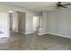 Open concept living room with tile flooring at 10030 W Illini St, Tolleson, AZ 85353