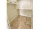 Walk-in closet with tile flooring, shelving, and a clothing rod at 10030 W Illini St, Tolleson, AZ 85353