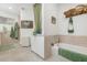 Well-lit bathroom featuring a soaking tub, neutral tile, and vintage-inspired decor and accessories at 1047 E 9Th St, Mesa, AZ 85203