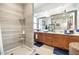 Spacious bathroom featuring a shower and double vanity with a large mirror and vanity at 1047 E 9Th St, Mesa, AZ 85203