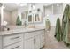 Bathroom vanity with ample storage, large mirror, and modern lighting fixtures at 1047 E 9Th St, Mesa, AZ 85203