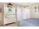 Bright bedroom with a decorative cabinet, closet, and cozy carpets at 1047 E 9Th St, Mesa, AZ 85203