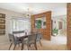 Dining area features a modern light fixture, natural light, and a decorative brick wall accent at 1047 E 9Th St, Mesa, AZ 85203