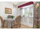 Charming dining nook with natural light, classic furnishings, and decorative window treatment at 1047 E 9Th St, Mesa, AZ 85203