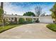 Spacious home featuring a wide driveway, two-car garage, and drought-resistant landscaping at 1047 E 9Th St, Mesa, AZ 85203