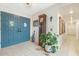 Inviting foyer with a double door, eye catching tile flooring and a vintage grandfather clock at 1047 E 9Th St, Mesa, AZ 85203