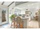 Bright kitchen with a breakfast bar and white cabinets, offering a cozy and modern cooking space at 1047 E 9Th St, Mesa, AZ 85203