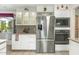 Modern kitchen with stainless steel refrigerator and built-in oven and microwave at 1047 E 9Th St, Mesa, AZ 85203