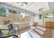 Relaxing sunroom with natural light, comfortable seating, and screened windows at 1047 E 9Th St, Mesa, AZ 85203