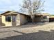 Back exterior shot revealing backyard with shed, patio and desert landscaping at 1109 E Emerald Ave, Mesa, AZ 85204