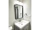 Updated bathroom featuring a modern vanity and sleek black framed mirror at 1109 E Emerald Ave, Mesa, AZ 85204