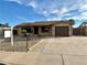 Charming single-story home with desert landscaping and an attached one-car garage at 1109 E Emerald Ave, Mesa, AZ 85204