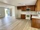 Bright kitchen with wood cabinets, white countertops, and stainless steel appliances at 1109 E Emerald Ave, Mesa, AZ 85204